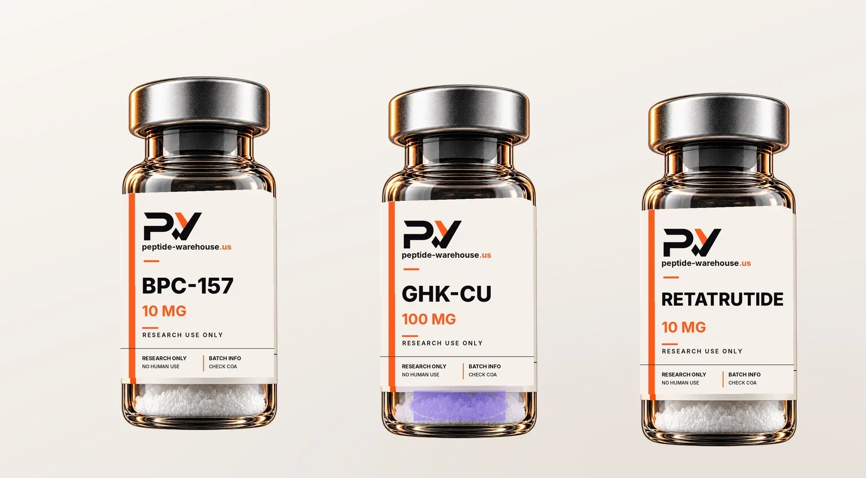 BPC-157, GHK-Cu, and retatrutide research vials on a warm ivory studio surface.