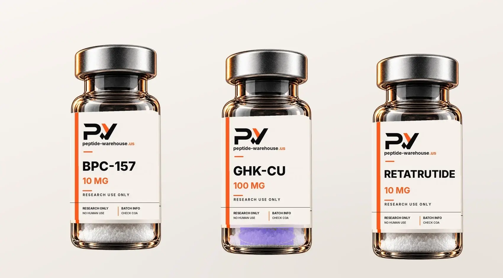 BPC-157, GHK-Cu, and retatrutide research vials on a warm ivory studio surface.